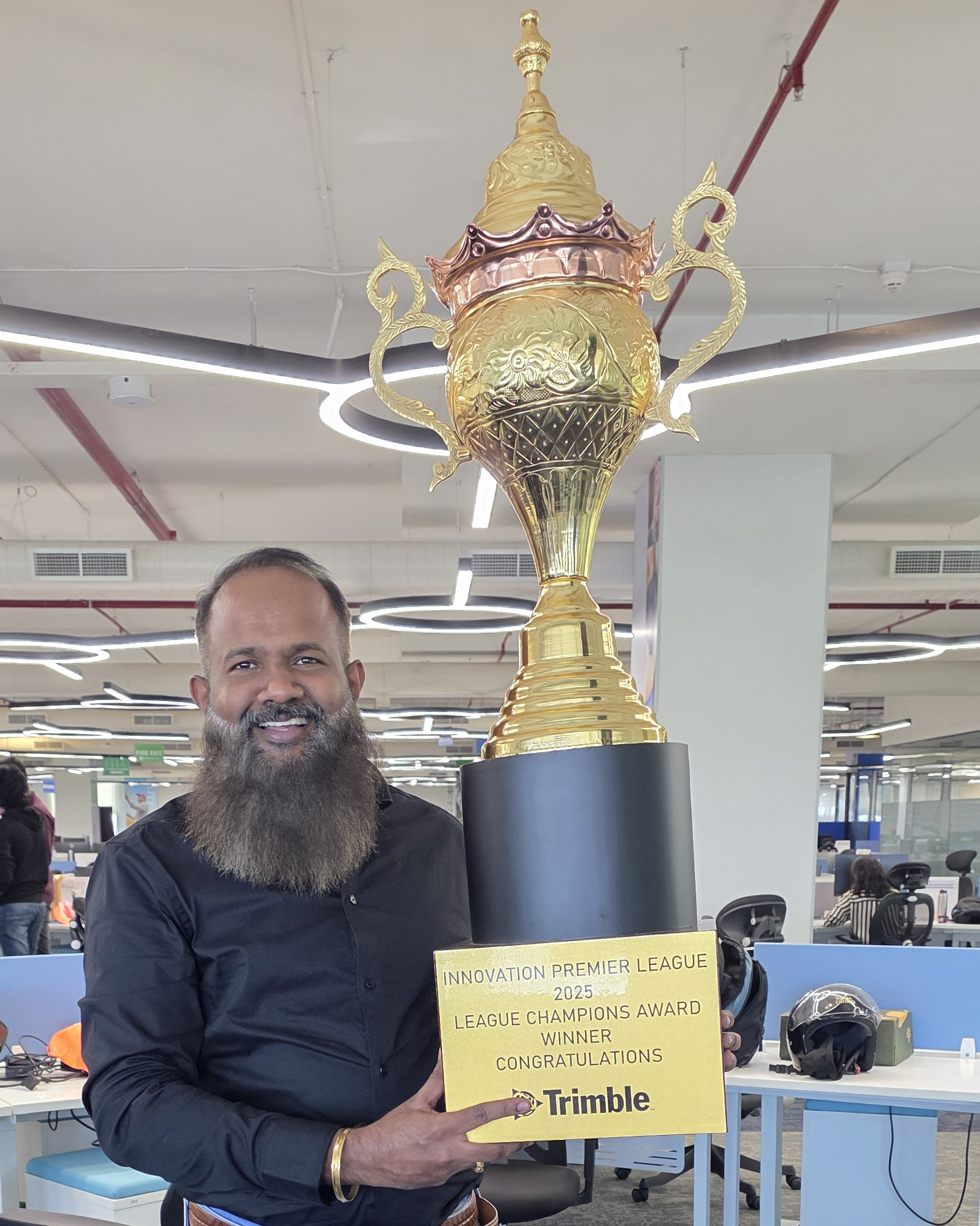 Shunmugavel Mariappan with the Innovation Premier League (IPL) winner cup